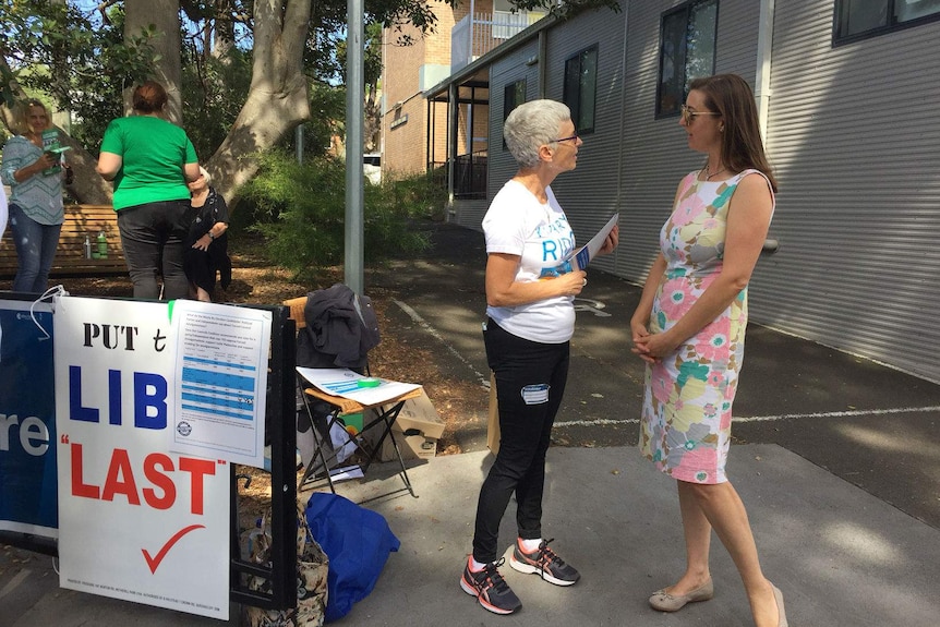 Independent candidate talking to her campaign volunteer