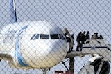 Passengers evacuate a hijacked EgyptAir Airbus 320 plane at Larnaca airport, Cyprus.