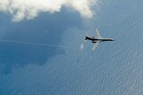 A B-1B Lancer from Dyess Air Force Base, Texas flies over the sea