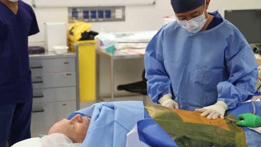 Dr Donald Kuah removing stem cells from a patient during a procedure