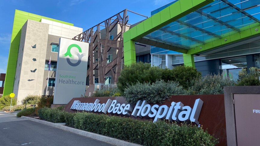 A colourful, modern-looking hospital with sign reading "Warrnambool Base Hospital".