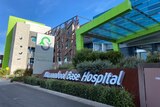 A colourful, modern-looking hospital with sign reading "Warrnambool Base Hospital".