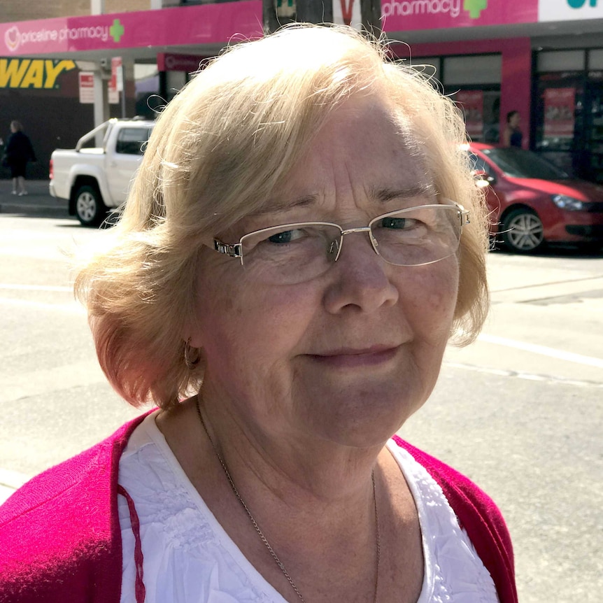 Lady in glasses on the street.