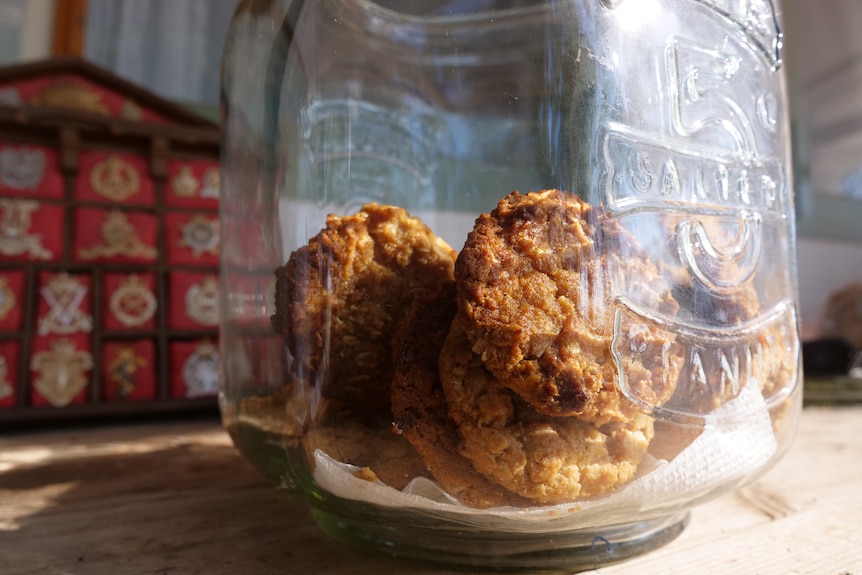 anzac biscuits sitting in a jar on a table
