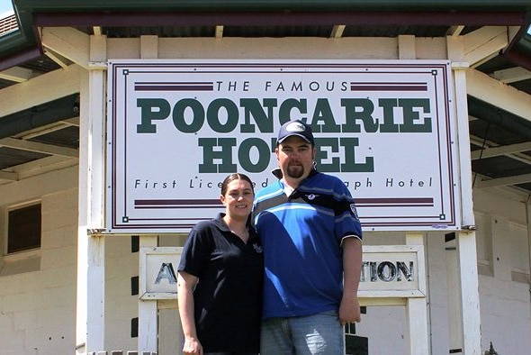 Image of Josh and Lee Sheard outside the pub in Pooncarie