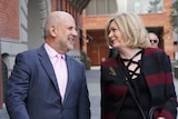 Mid shot of Perth Lord Mayor Lisa Scaffidi joking with her lawyer Steven Penglis outside a SAT hearing.
