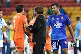 Brisbane Roar team-mates Shane Stefanutto and Jamie Young have to be separated after the loss to Melbourne City