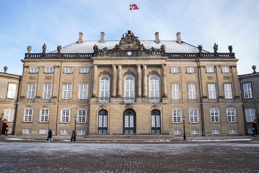 Frederik VIII's Palace, which is about three storeys high with a second-floor balcony at the front