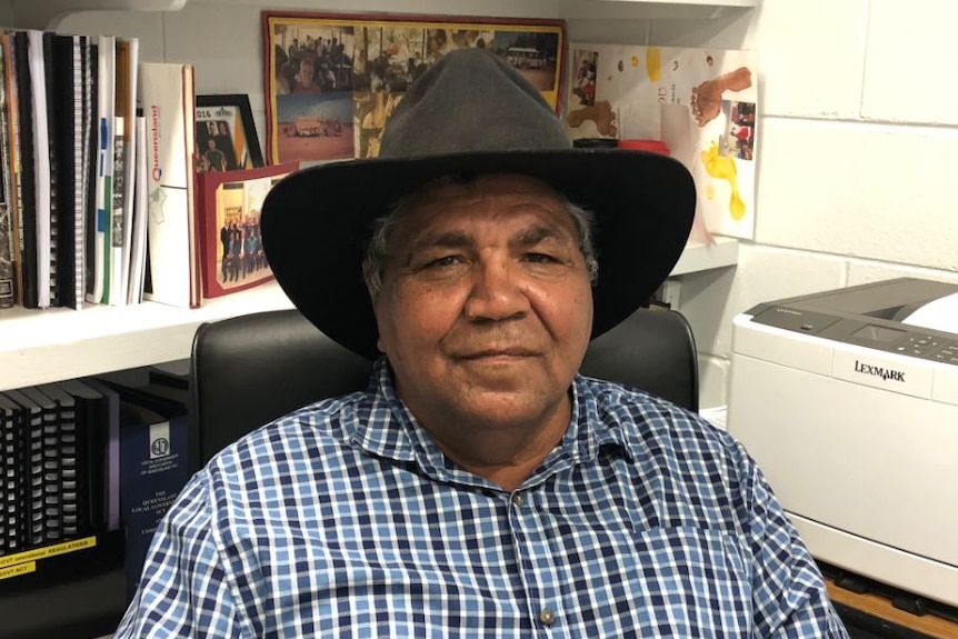 Mayor Dereck Walpo sitting at desk in Aurukun