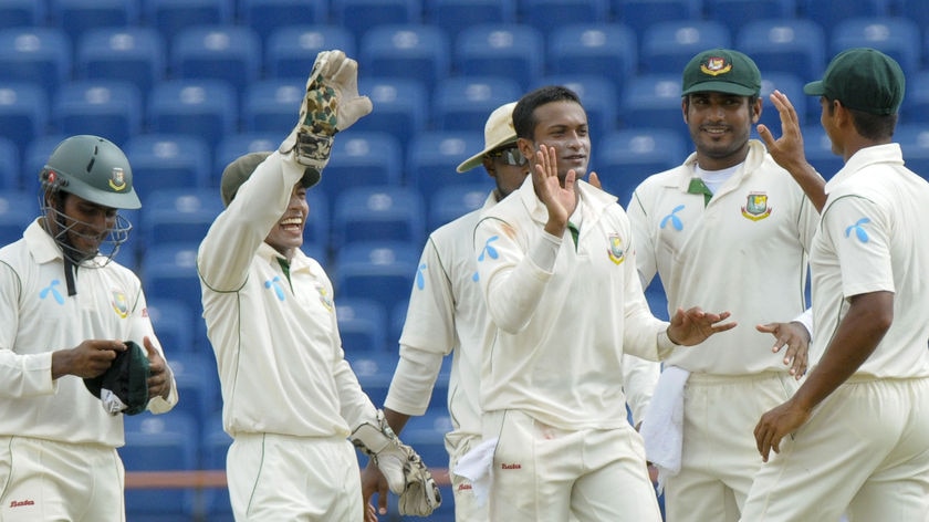 Shakib Al Hasan (centre) celebrates another wicket for the Tigers.