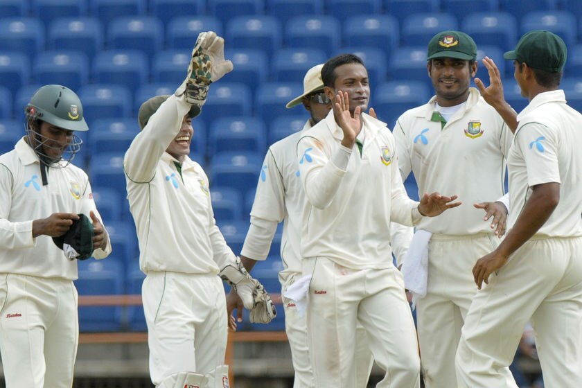 Shakib Al Hasan (centre) celebrates another wicket for the Tigers.