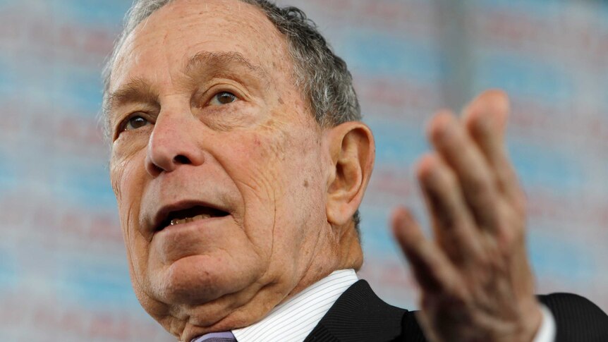 Michael Bloomberg gestures.