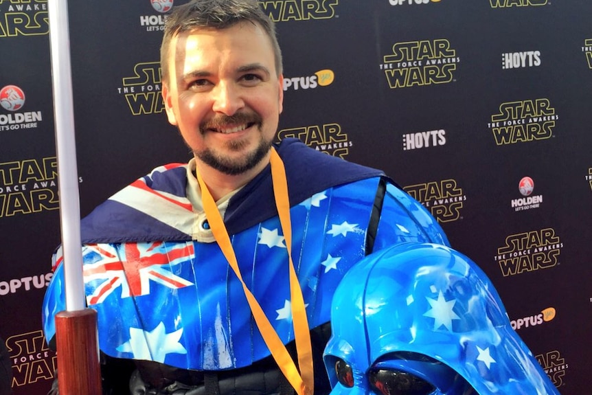Star Wars fan Aussie Vader dressed in his Darth Vader costume, which features the Australian flag.