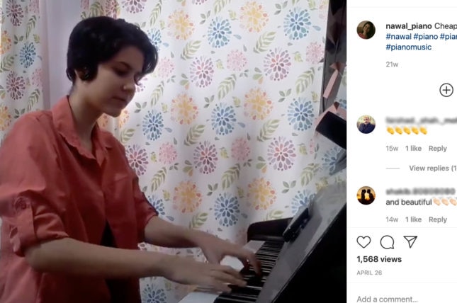 A girl plays the piano in an Instagram post.