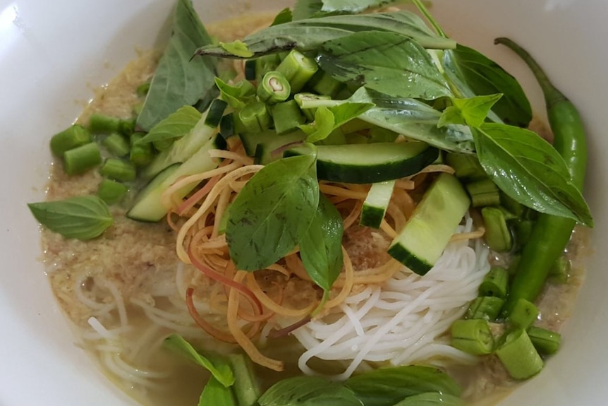 Khmer noodle soup, or num banh chok, is a popular local dish in Cambodia.