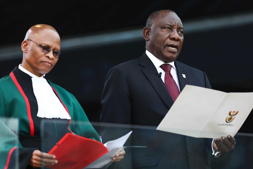 South African President Cyril Ramaphosa takes the oath of office alongside Chief Justice, Mogoeng Mogoeng
