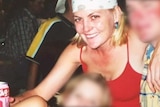 A photograph of a woman in a bandana and red singlet holding a can of drink