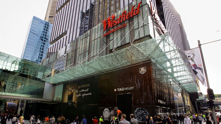 Pedestrians walk past the Westfield shopping centre on Pitt Street Mall in Sydney.