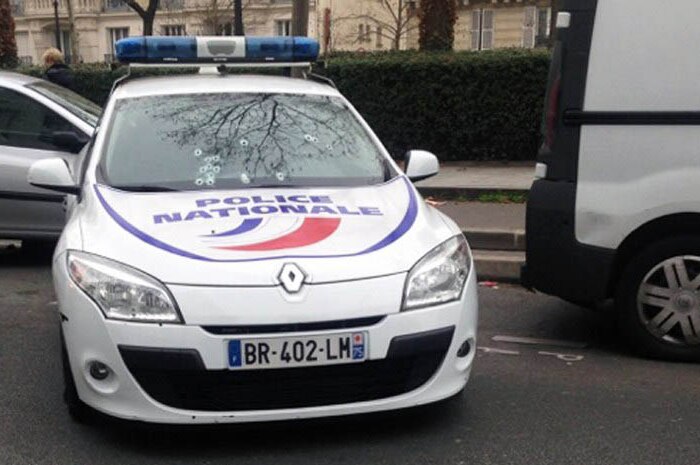 A photo taken on January 7, 2015 shows a police car riddled with bullets during an attack on the offices of the newspaper Charlie Hebdo