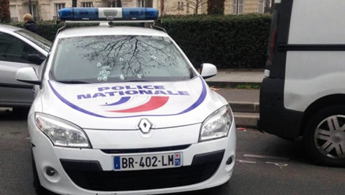 A photo taken on January 7, 2015 shows a police car riddled with bullets during an attack on the offices of the newspaper Charlie Hebdo