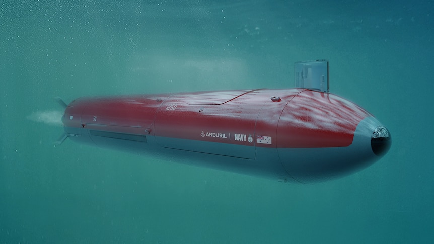 A mock-up of a red torpedo-like underwater vehicle navigates the ocean