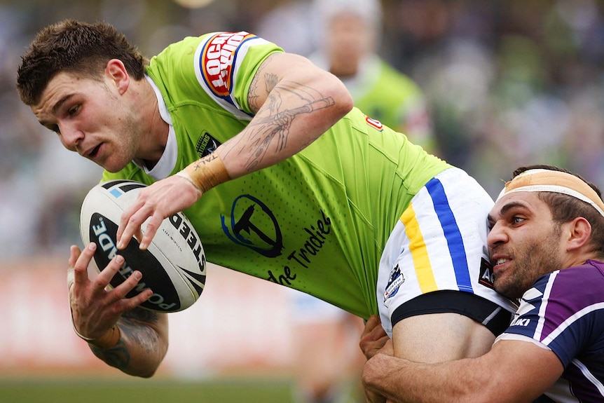 Josh Dugan is tackled by Maurice Blair