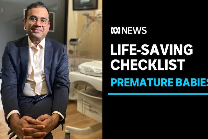Life-Saving Checlist, Premature Babies: A man in a doctors office sits cross-legged.