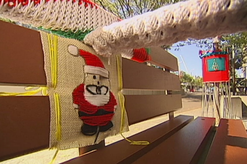 Seat decorated with knitted santa in Townsville's CBD in December 2014