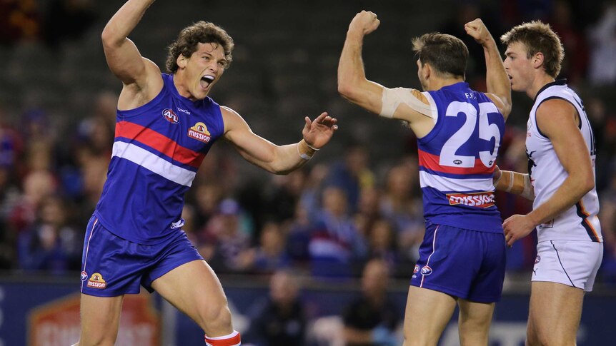 The Western Bulldogs' Will Minson celebrates after kicking a goal against Adelaide.