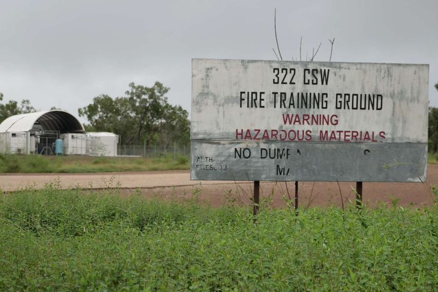 A sign for a fire training ground near Tindal Air Force Base warning of hazardous materials.