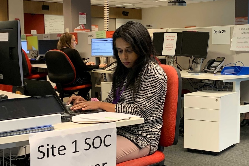 Members of the coronavirus contact tracing team working in an office.