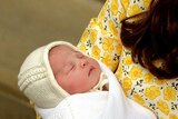 Catherine, Duchess of Cambridge, holds her newly-born daughter