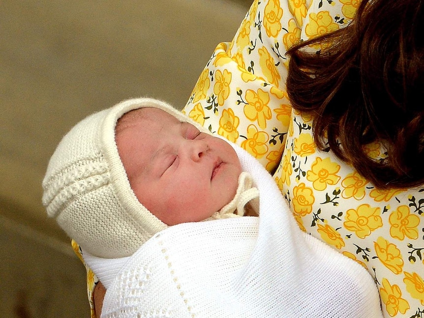 Catherine, Duchess of Cambridge, holds her newly-born daughter.