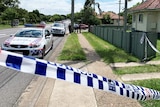 Police cars and tape outside a house at Zillmere on Brisbane's north on March 7, 2020.