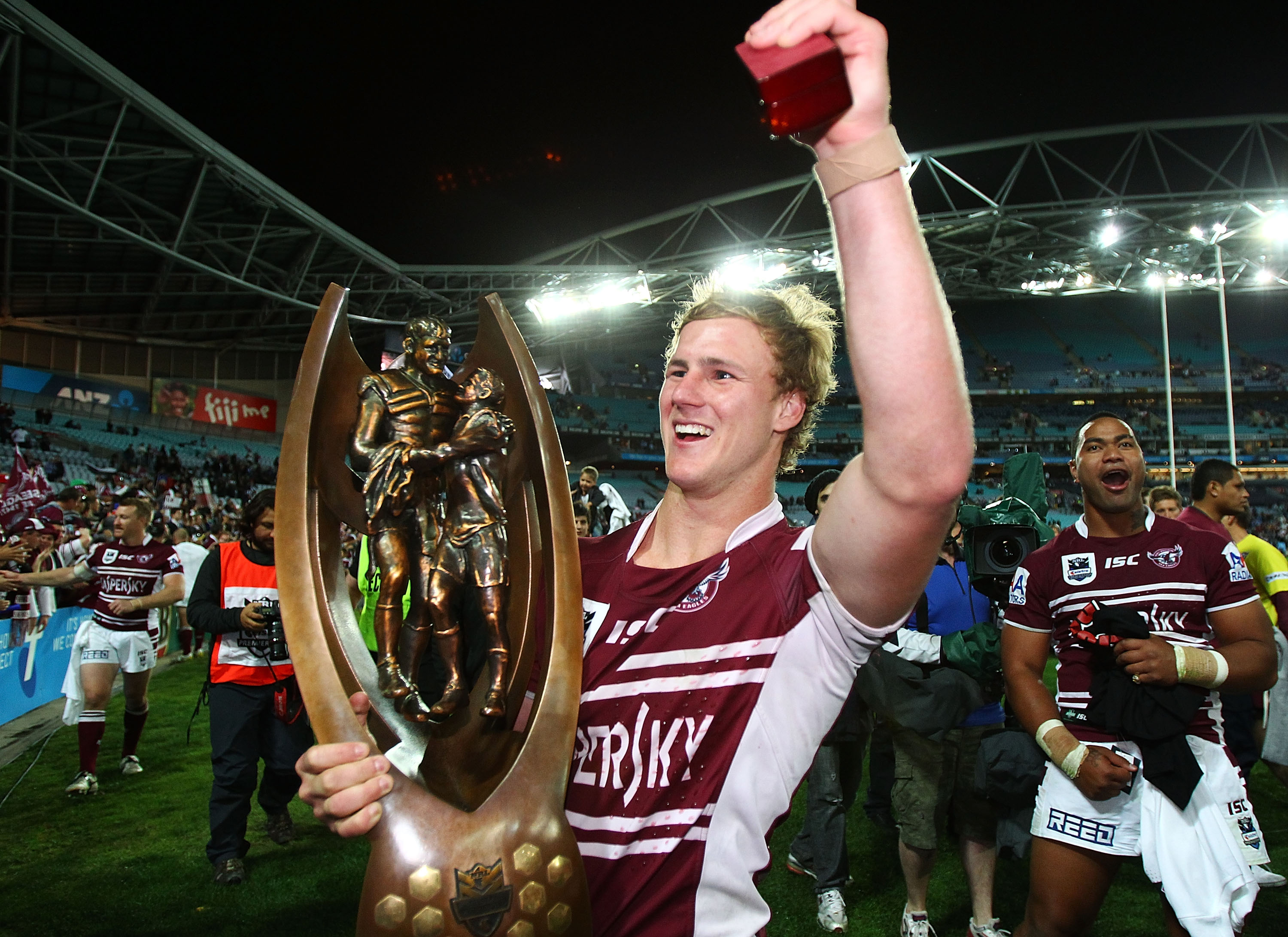 A man celebrates winning a premiership