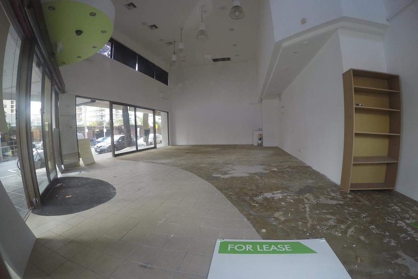 An empty shop in Surfers Paradise displays a for lease sign