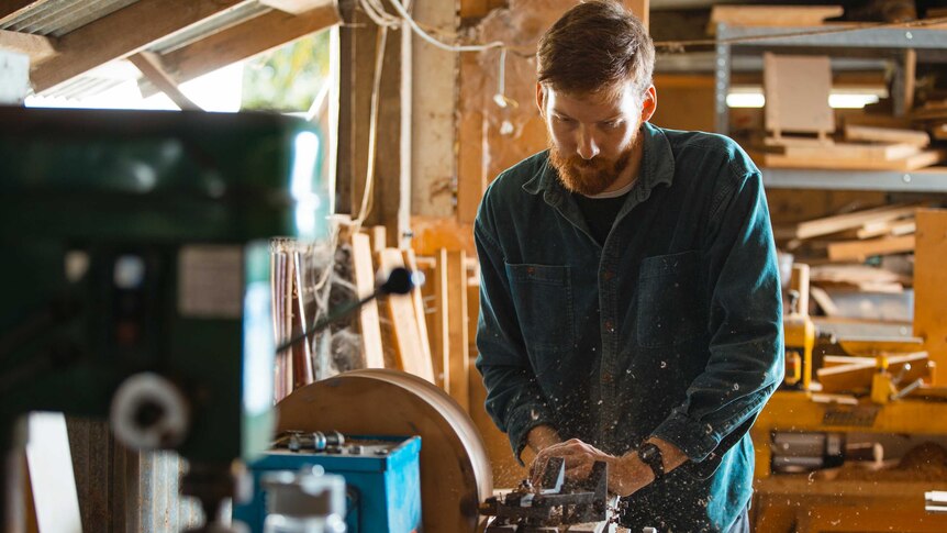 Beau Jorgensen of Haldane Drums making a steam-bent snare drum using a planer to smooth the outside of the cylindrical shell.