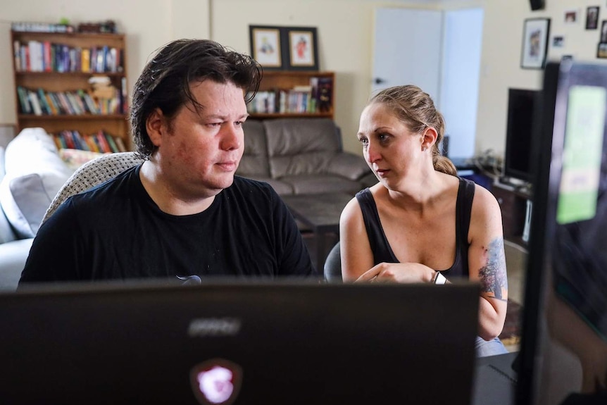 Megan Summers and her business partner from Screwtape Studios at a desk