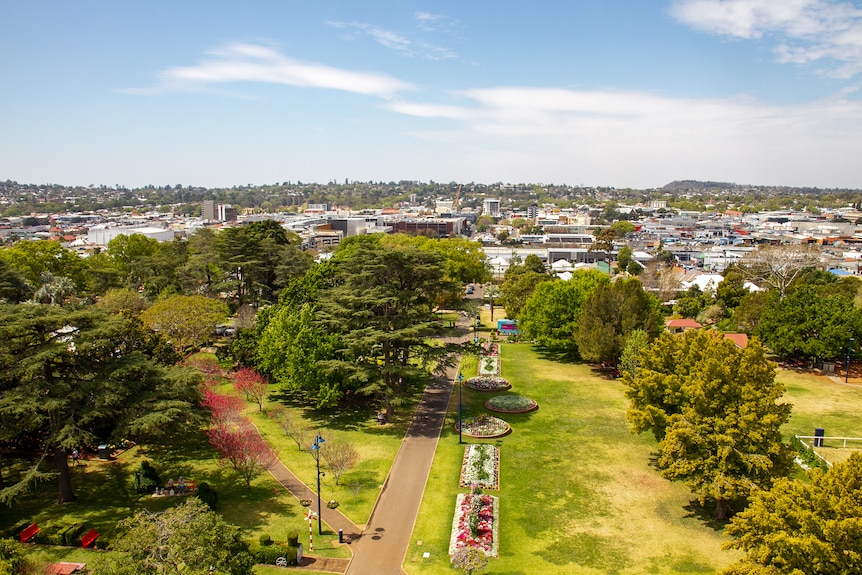 An aerial shot of Toowoomba, with a park in the foreground and buildings in the background.