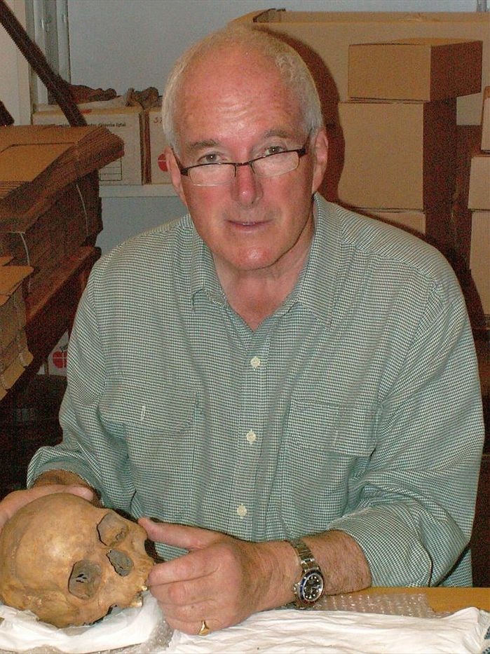 A man with a skull.