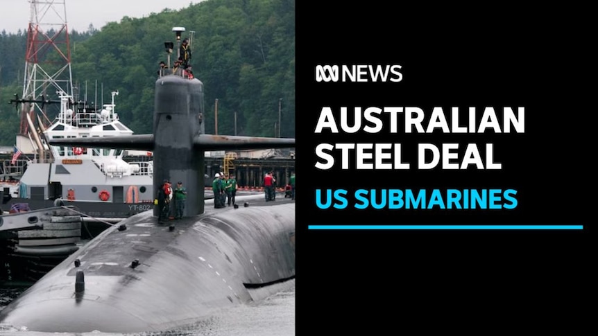 Australian Steel Deal, US Submarines: A submarine at a dock with sailers on its hull and coning tower.