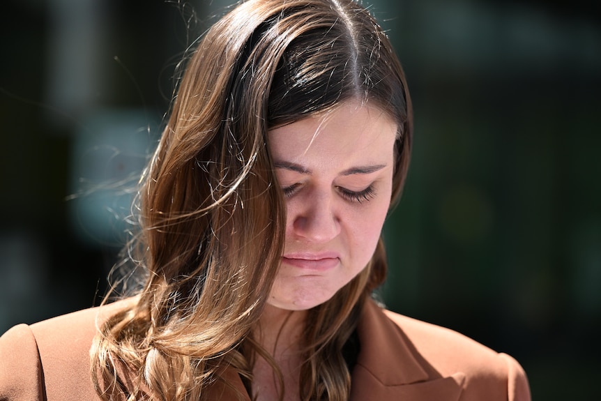 Brittany Higgins crying while making a statement outside court.