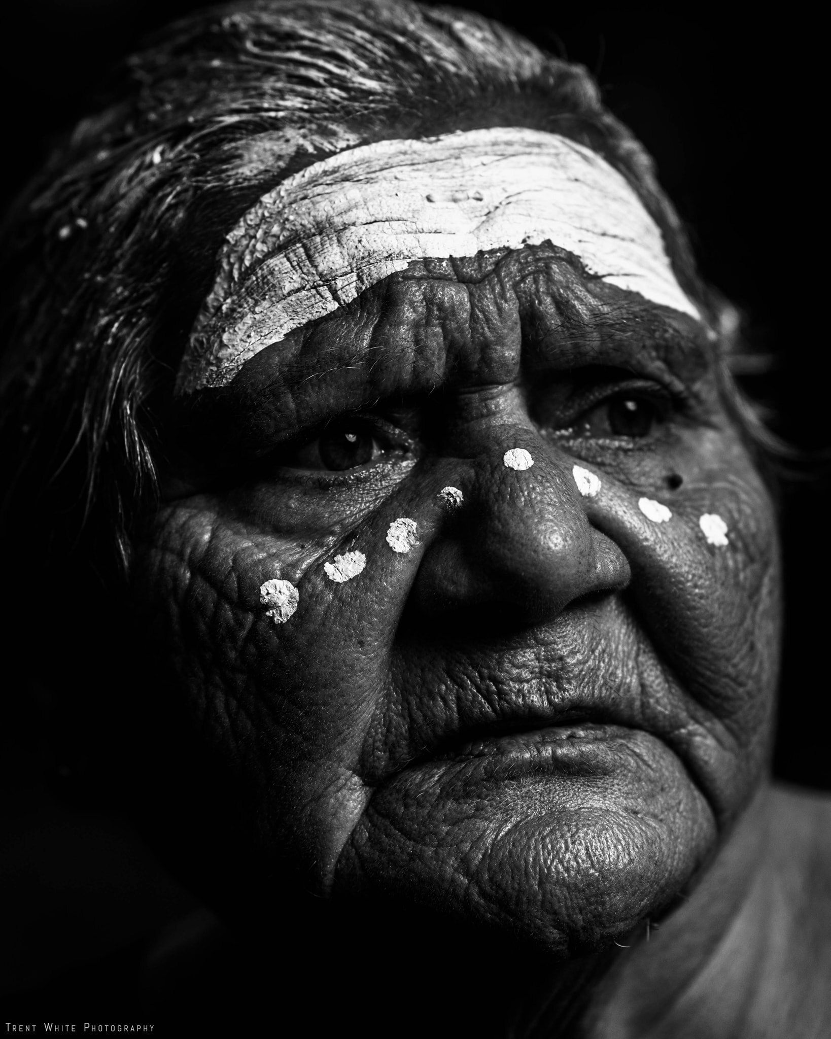 Aunty Venita Mann nee Fisher, close up, black and white, dots and lines painted on her face.