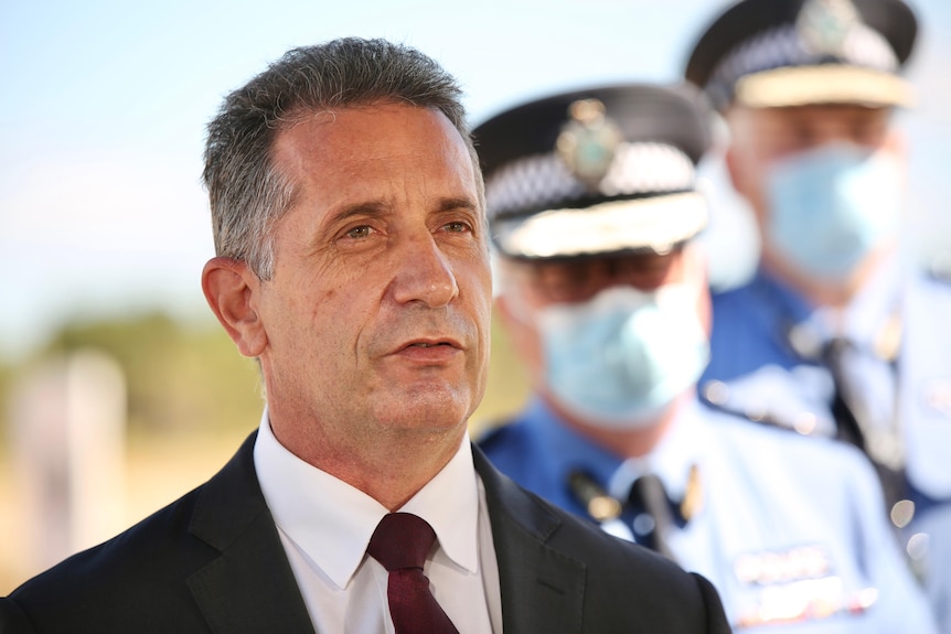 A head and shoulders shot of WA Police Minister Paul Papalia speaking at a media conference outdoors.