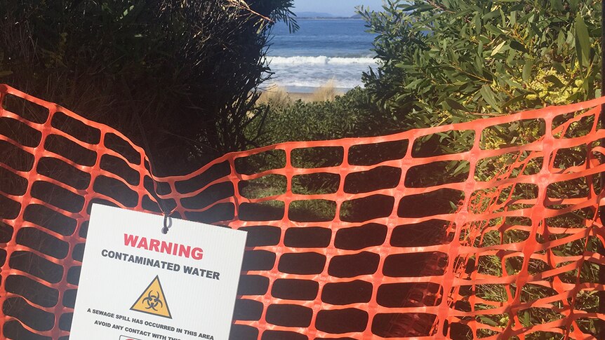 Temporary fencing at entrance to beach.