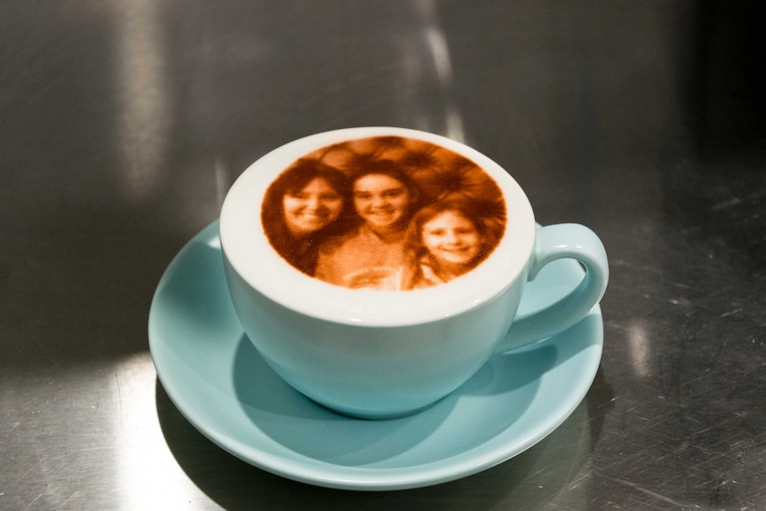 A coffee with a picture printed onto the foam