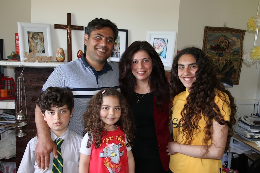 Malak Abdou with his family in Tasmania.