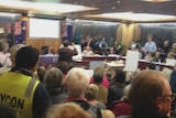 Protesters direct chants towards council officials at the first meeting of the new Inner West Counci.