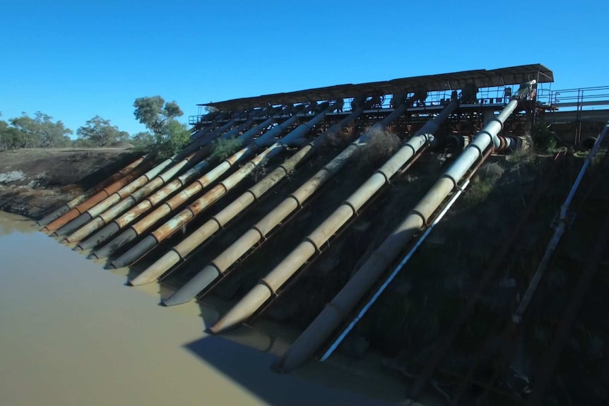 Pumps leading into a river