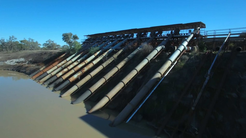 Pumps leading into a river